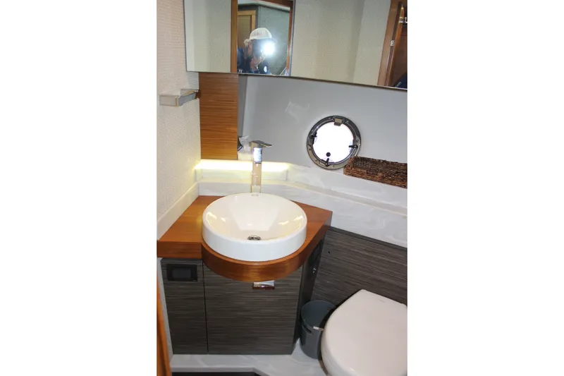 Slide: The Image of Modern bathroom interior of 2019 Tiara Yachts C39 Coupe with round sink and porthole window. - 81