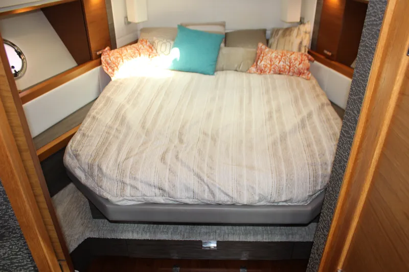 Slide: The Image of Luxurious bedroom interior of 2019 Tiara Yachts C39 Coupe with cozy bedding and pillows. - 77