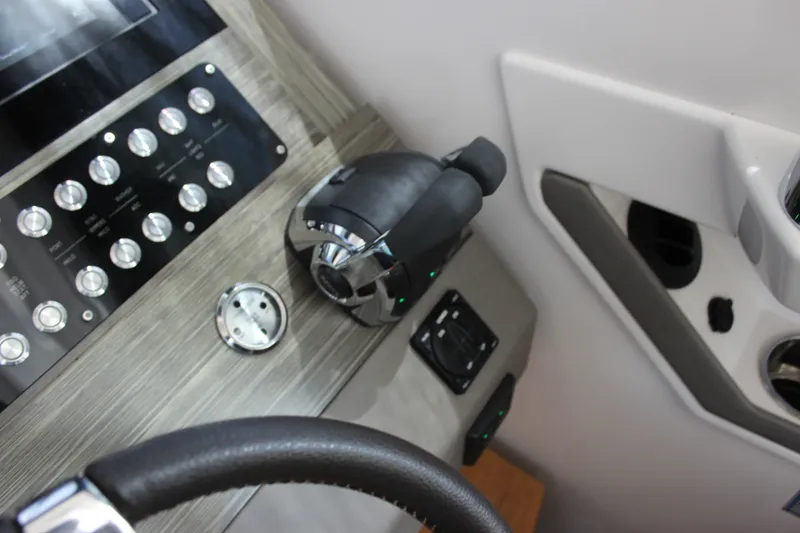 Slide: The Image of Control panel of 2019 Tiara Yachts C39 Coupe with steering wheel and throttle. - 100