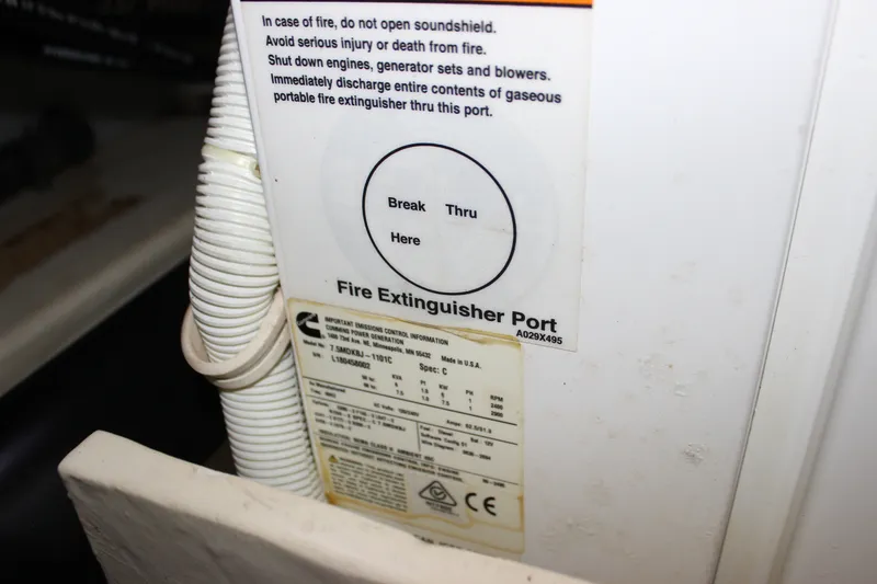 Slide: The Image of Fire extinguisher port instructions on 2019 Tiara Yachts C39 Coupe. - 52