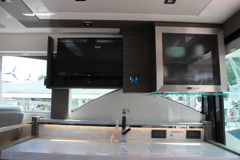 Slide: The Image of Interior of 2019 Tiara Yachts C39 Coupe featuring modern kitchen amenities and sleek design. - 55