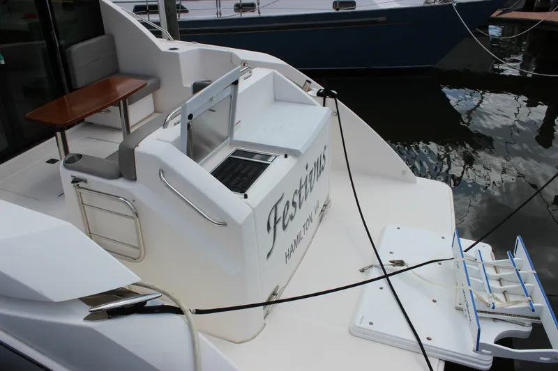 Slide: The Image of 2019 Tiara Yachts C39 Coupe stern view with seating and table. - 15