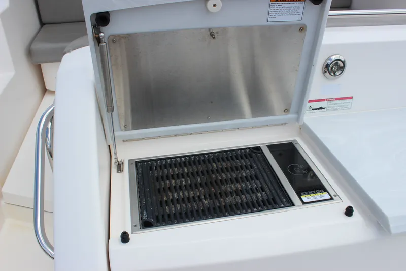 Slide: The Image of Outdoor grill on 2019 Tiara Yachts C39 Coupe, featuring Kenyon electric cooktop. - 16