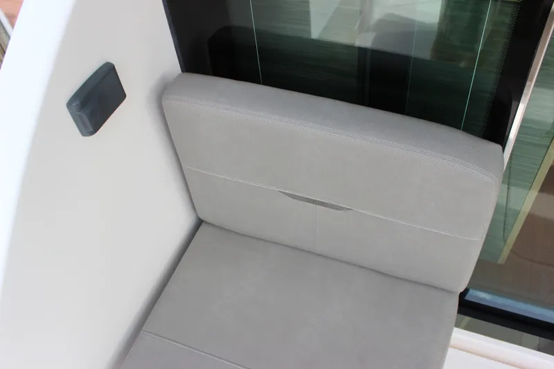 Slide: The Image of Gray seating area on 2019 Tiara Yachts C39 Coupe, near glass window. - 19