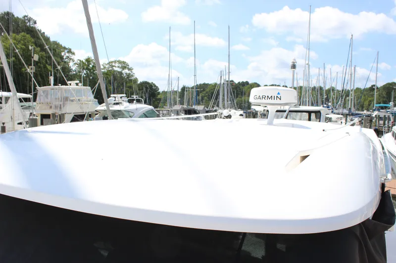 Slide: The Image of 2019 Tiara Yachts C39 Coupe docked, featuring Garmin navigation equipment. - 39