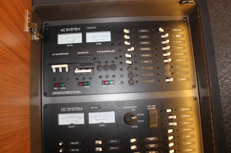 Slide: The Image of Electrical control panel on a 2019 Tiara Yachts C39 Coupe, featuring AC and DC systems. - 85