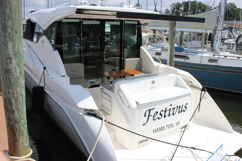 Slide: The Image of 2019 Tiara Yachts C39 Coupe docked, named "Festivus," in Hamilton, VA marina. - 30