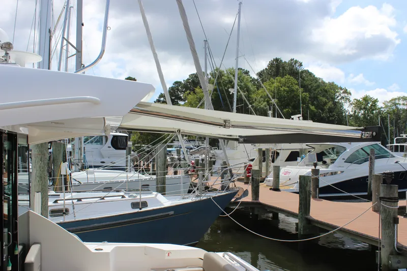 Slide: The Image of 2019 Tiara Yachts C39 Coupe docked at marina with extended awning. - 27