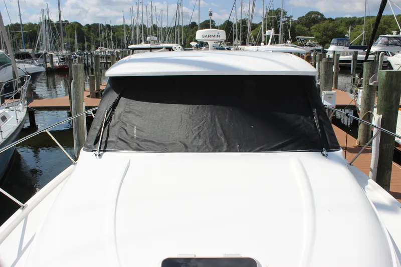 Slide: The Image of 2019 Tiara Yachts C39 Coupe docked at marina with covered windshield. - 38