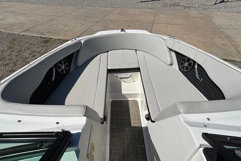 Slide: The Image of 2021 Sea Ray SPX 190 Outboard boat interior with gray seating and speakers. - 18