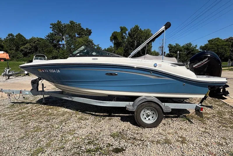 The Image of 2021 Sea Ray SPX 190 Outboard boat on trailer, parked outdoors. - 0