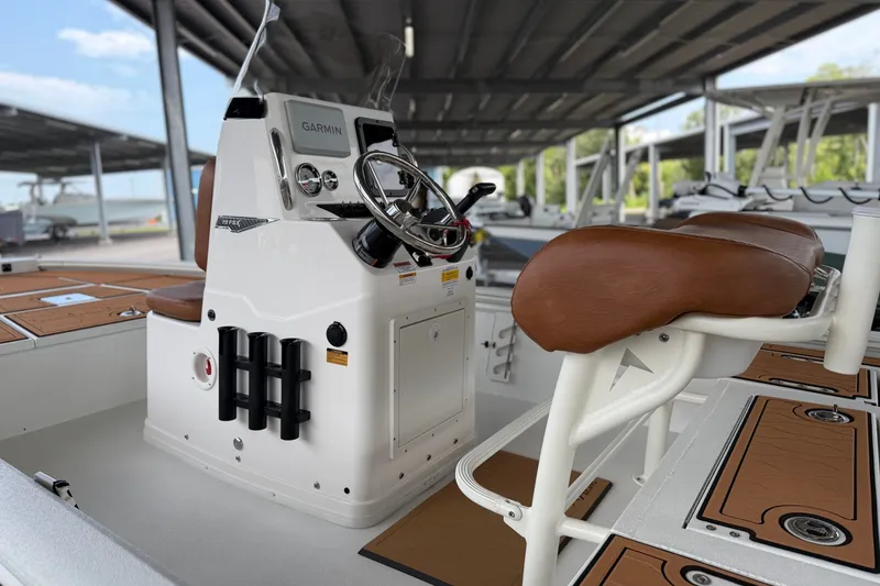 Slide: The Image of Avid 19 FSX 2027 boat interior with steering console and seating. - 16