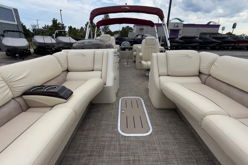 Slide: The Image of Luxurious interior of a 2015 Bennington 2550 RSR pontoon boat with plush seating. - 28