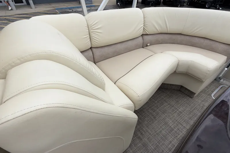 Slide: The Image of Luxurious seating on a 2015 Bennington 2550 RSR pontoon boat with beige upholstery. - 20