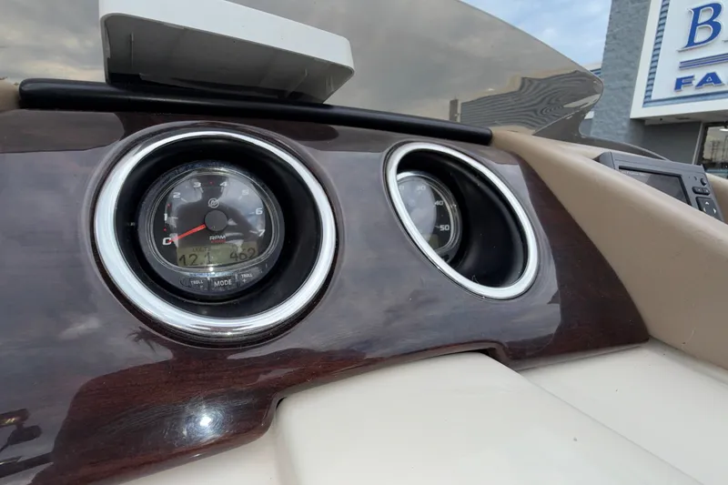 Slide: The Image of Dashboard of 2015 Bennington 2550 RSR boat with gauges and controls. - 41