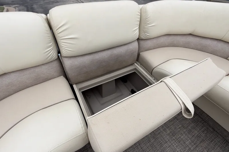Slide: The Image of 2015 Bennington 2550 RSR boat seating with open storage compartment. - 33