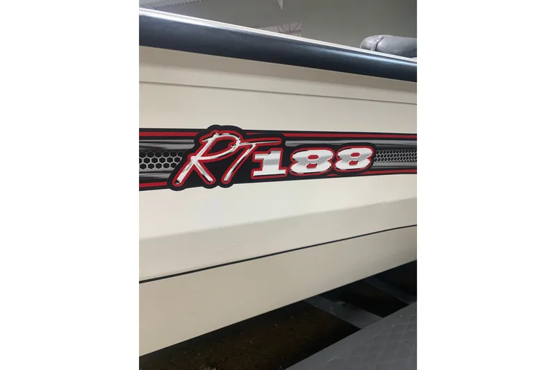 Slide: The Image of 2019 Ranger RT188 boat logo on side panel, featuring bold red and white design. - 5