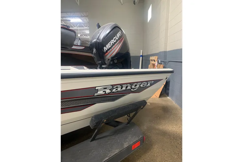 Slide: The Image of 2019 Ranger RT188 boat with Mercury engine in a garage setting. - 4
