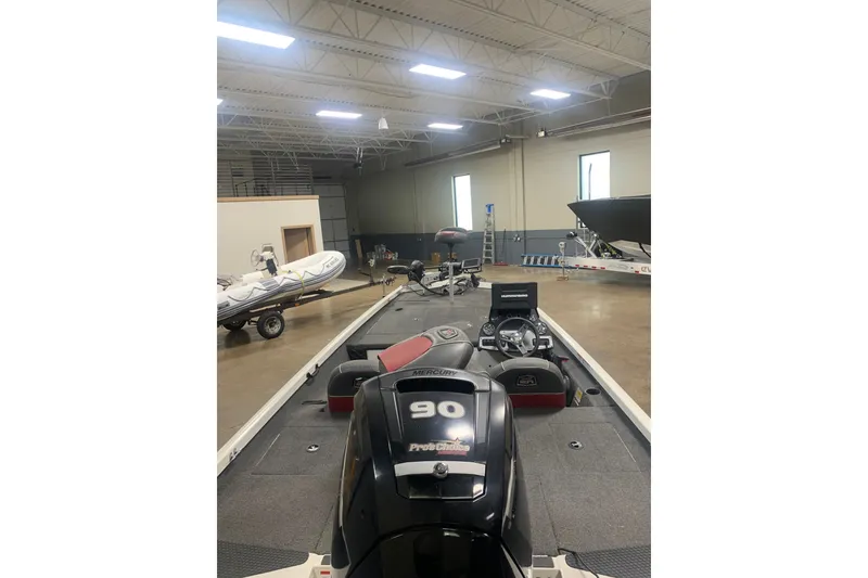 Slide: The Image of 2019 Ranger RT188 boat in a spacious indoor storage facility. - 7