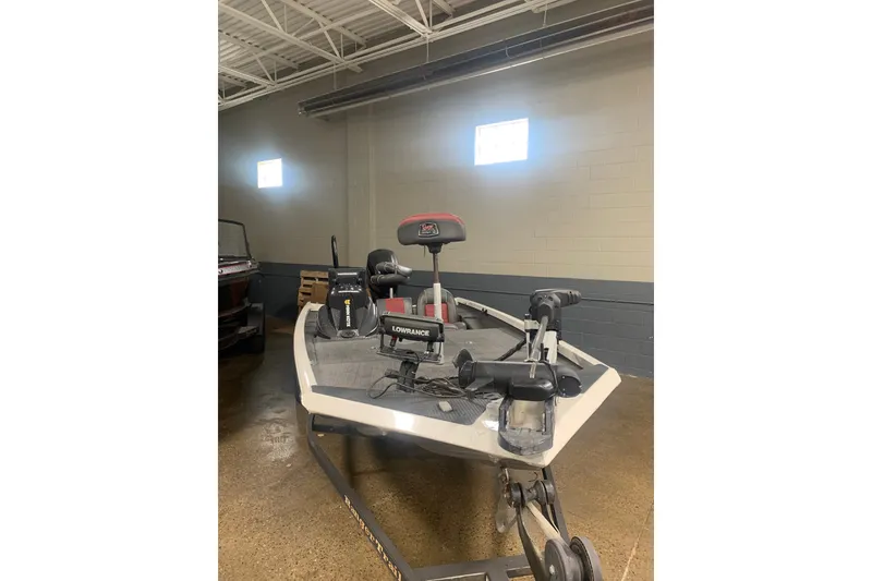 Slide: The Image of 2019 Ranger RT188 boat in a garage, featuring Lowrance electronics and Minn Kota trolling motor. - 2