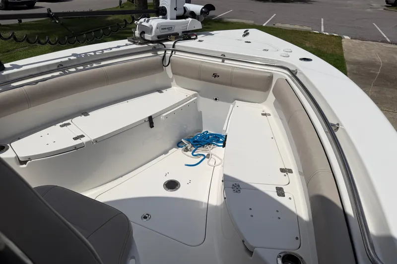 Slide: The Image of 2020 Sea Pro 239 Center Console boat interior with seating and storage compartments. - 26