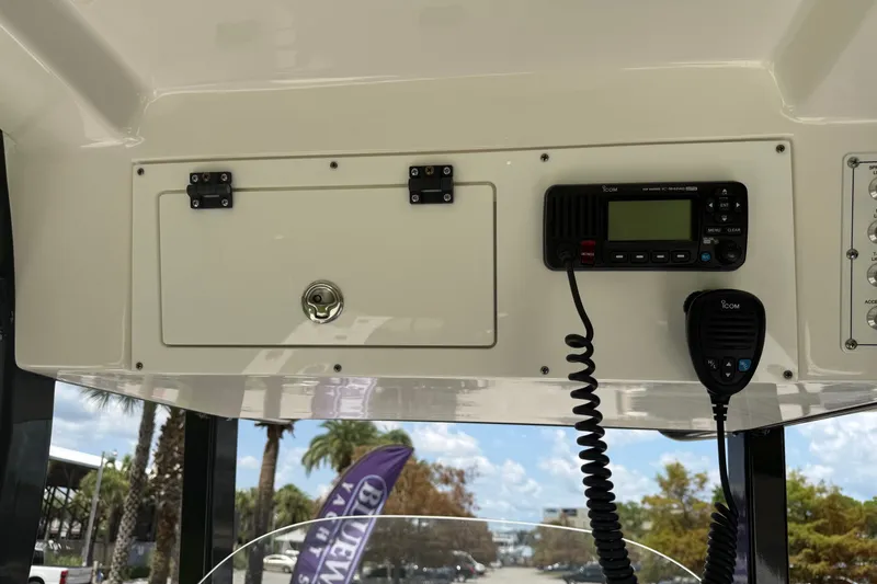 Slide: The Image of 2020 Sea Pro 239 Center Console dashboard with radio and storage compartment. - 17