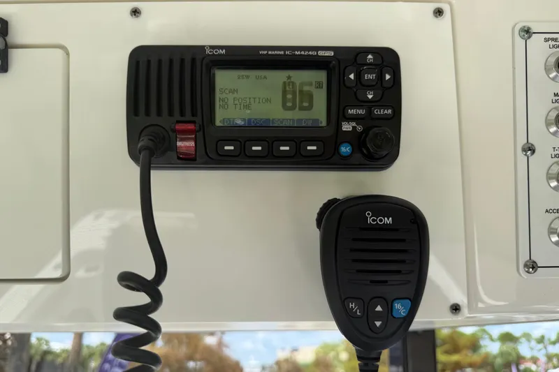 Slide: The Image of VHF marine radio on 2020 Sea Pro 239 Center Console boat dashboard. - 24