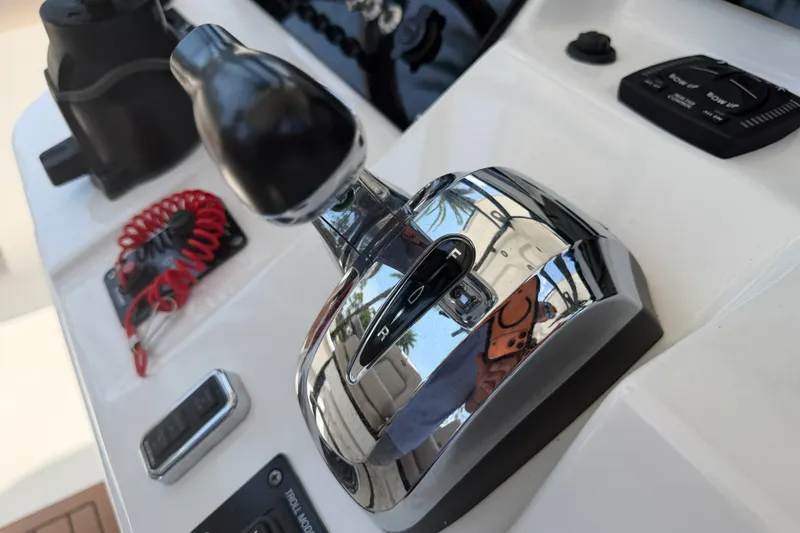 Slide: The Image of Close-up of 2020 Sea Pro 239 Center Console boat controls and throttle. - 25