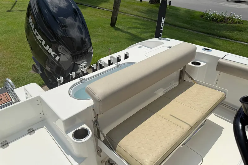 Slide: The Image of 2020 Sea Pro 239 Center Console boat with Suzuki engine and cushioned seating. - 13