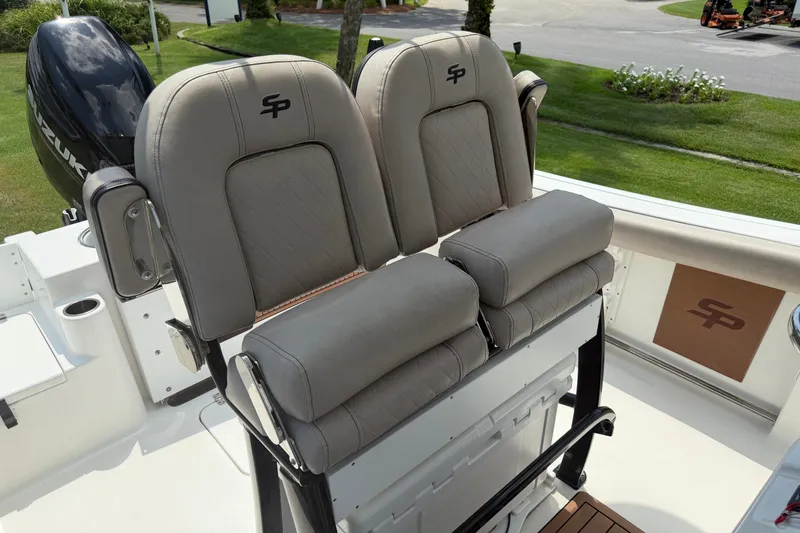 Slide: The Image of 2020 Sea Pro 239 Center Console boat with dual cushioned seats and Suzuki engine. - 15