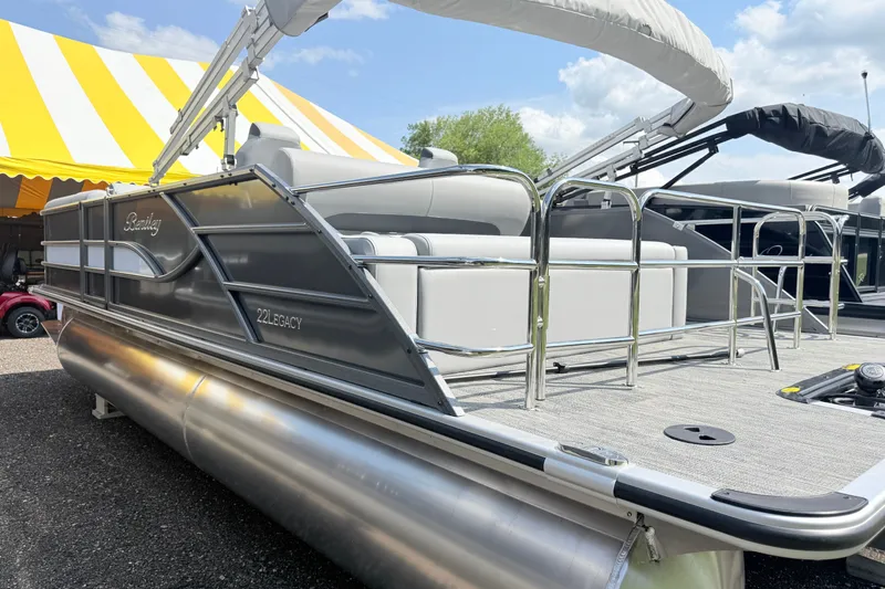 Slide: The Image of 2027 Bentley Pontoons Legacy 223 Swingback, sleek design, spacious seating, under a sunny sky. - 18