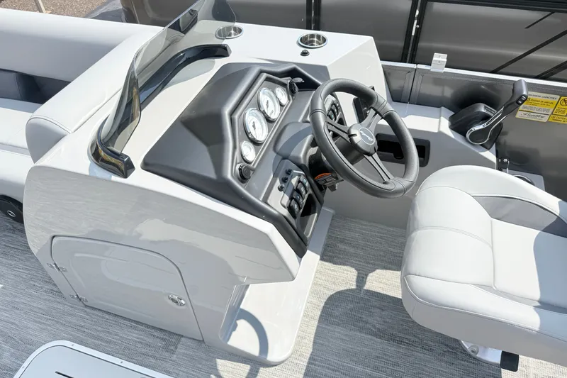 Slide: The Image of 2027 Bentley Pontoons Legacy 223 Swingback helm with modern controls and steering wheel. - 17