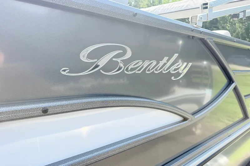 Slide: The Image of Close-up of 2027 Bentley Pontoons Legacy 223 Swingback logo on sleek exterior. - 21