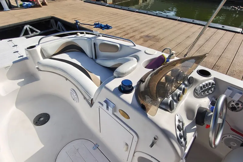 Slide: The Image of Interior of a 2005 Vectra S-200 boat with seating and control panel. - 9