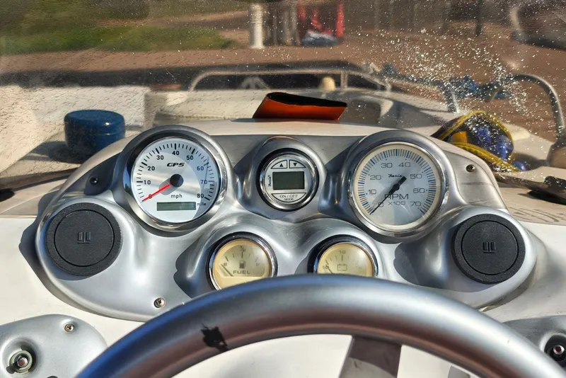 Slide: The Image of Dashboard of a 2005 Vectra S-200 boat with speedometer and fuel gauges. - 10