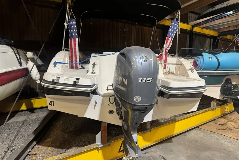 Slide: The Image of 2005 Vectra S-200 boat with Yamaha 115 engine in storage. - 14