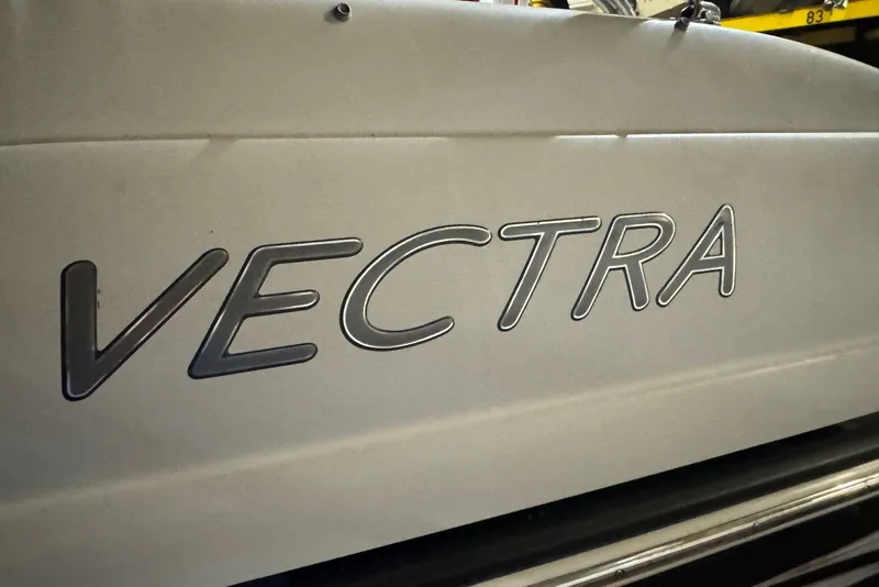 Slide: The Image of Close-up of 2005 Vectra S-200 boat logo on hull. - 16
