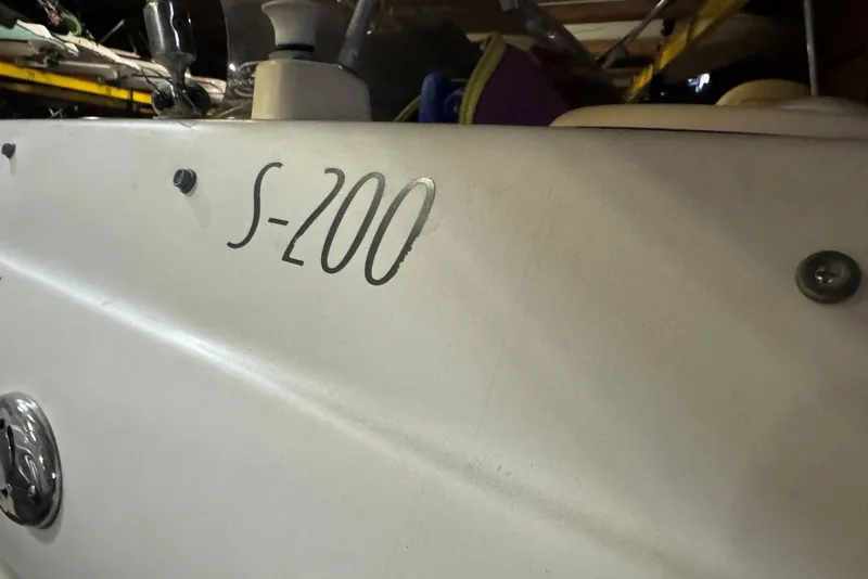 Slide: The Image of 2005 Vectra S-200 boat detail, showing model name on white surface. - 17