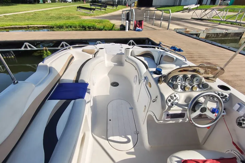 Slide: The Image of Interior of a 2005 Vectra S-200 boat docked at a marina. - 12