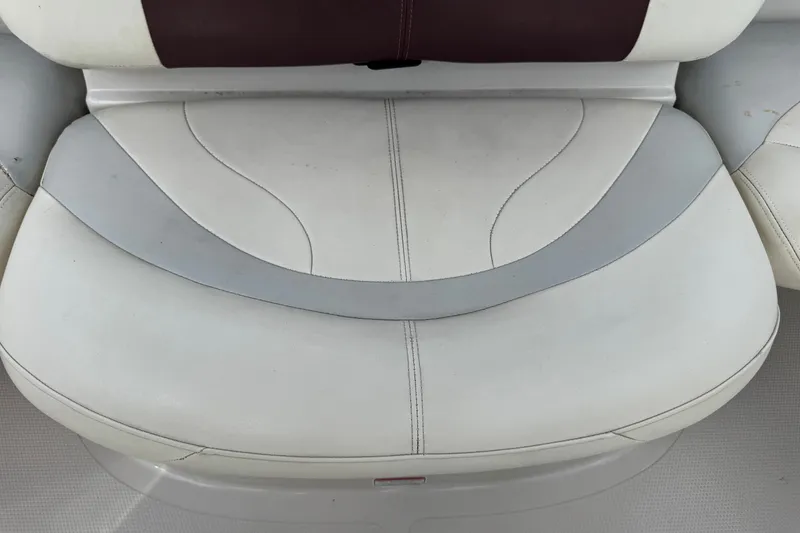 Slide: The Image of 2009 Tahoe Q4 SS boat seat with white and gray upholstery. - 13