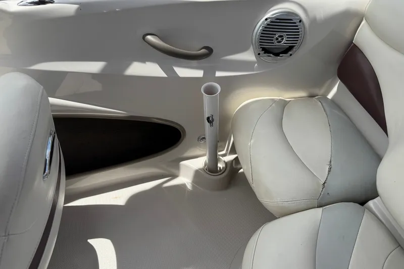 Slide: The Image of Interior of a 2009 Tahoe Q4 SS boat with white seating and speaker. - 20