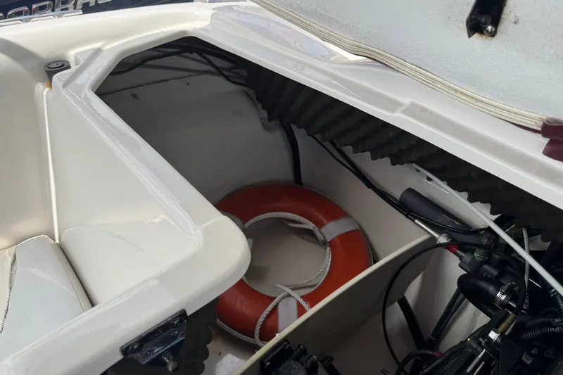 Slide: The Image of Storage compartment of a 2009 Tahoe Q4 SS boat with life preserver. - 23