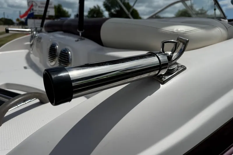 Slide: The Image of Close-up of a 2009 Tahoe Q4 SS boat's chrome cleat on white deck. - 8