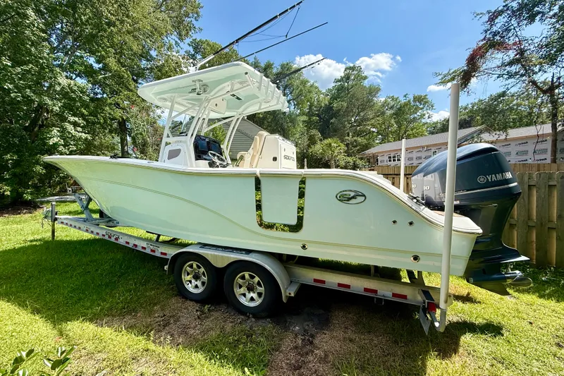 Slide: The Image of 2017 Sea Fox 288 Commander boat on trailer, parked in a grassy yard. - 1