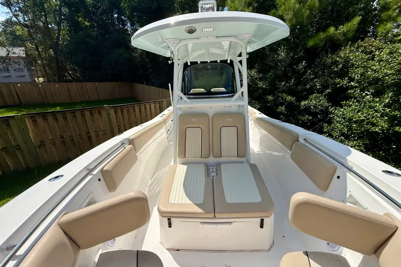 Slide: The Image of 2017 Sea Fox 288 Commander boat interior with cushioned seating and helm station. - 28