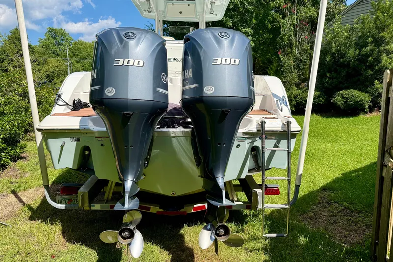 Slide: The Image of 2017 Sea Fox 288 Commander with dual Yamaha 300 engines, parked on grass. - 3