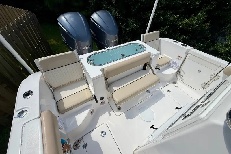 Slide: The Image of 2017 Sea Fox 288 Commander boat interior with seating and dual Yamaha engines. - 14
