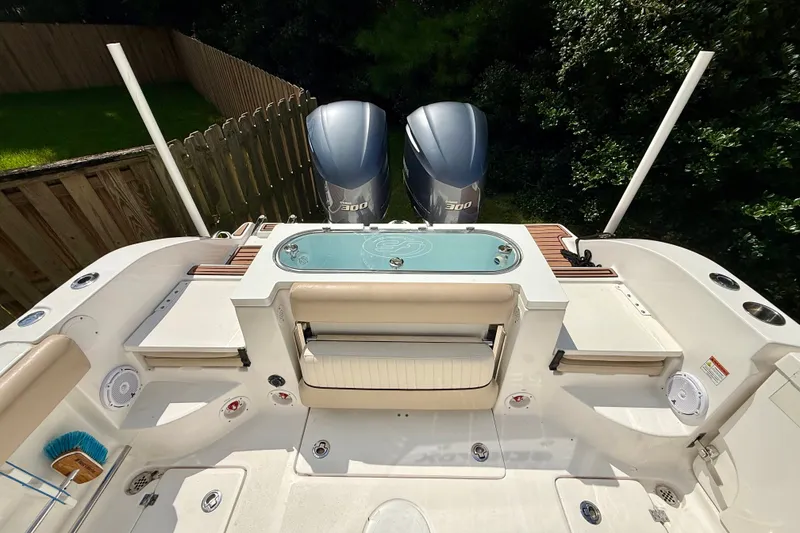 Slide: The Image of 2017 Sea Fox 288 Commander boat deck with dual engines and seating area. - 12