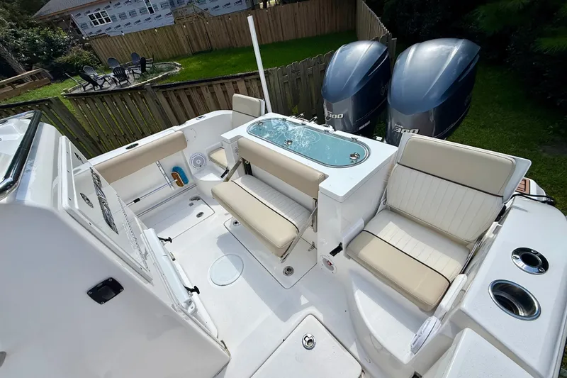 Slide: The Image of 2017 Sea Fox 288 Commander boat interior with seating and dual engines. - 15