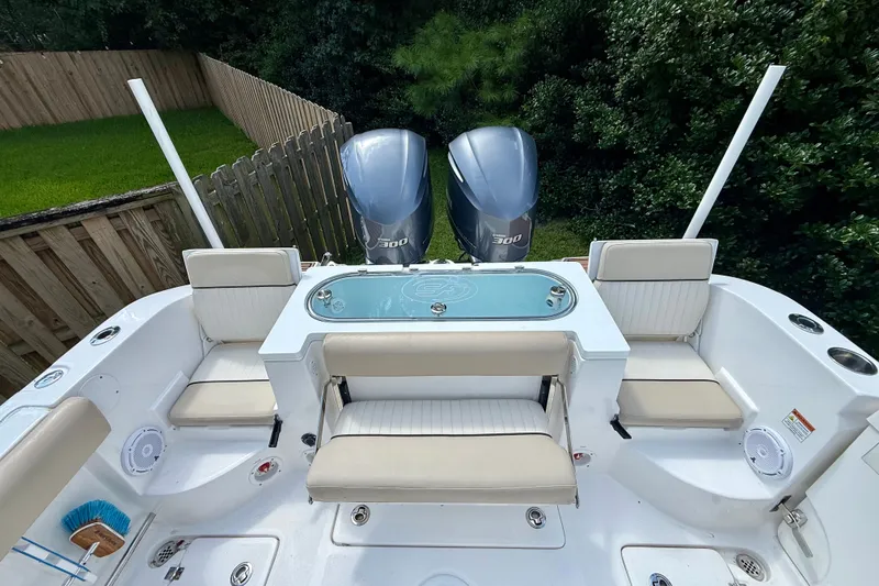 Slide: The Image of 2017 Sea Fox 288 Commander boat interior with twin engines and seating area. - 13